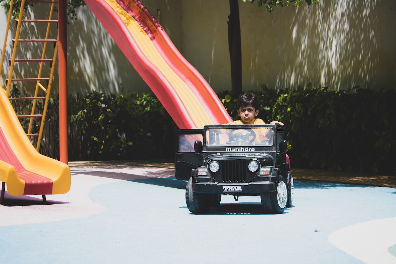 kid using ride-on car